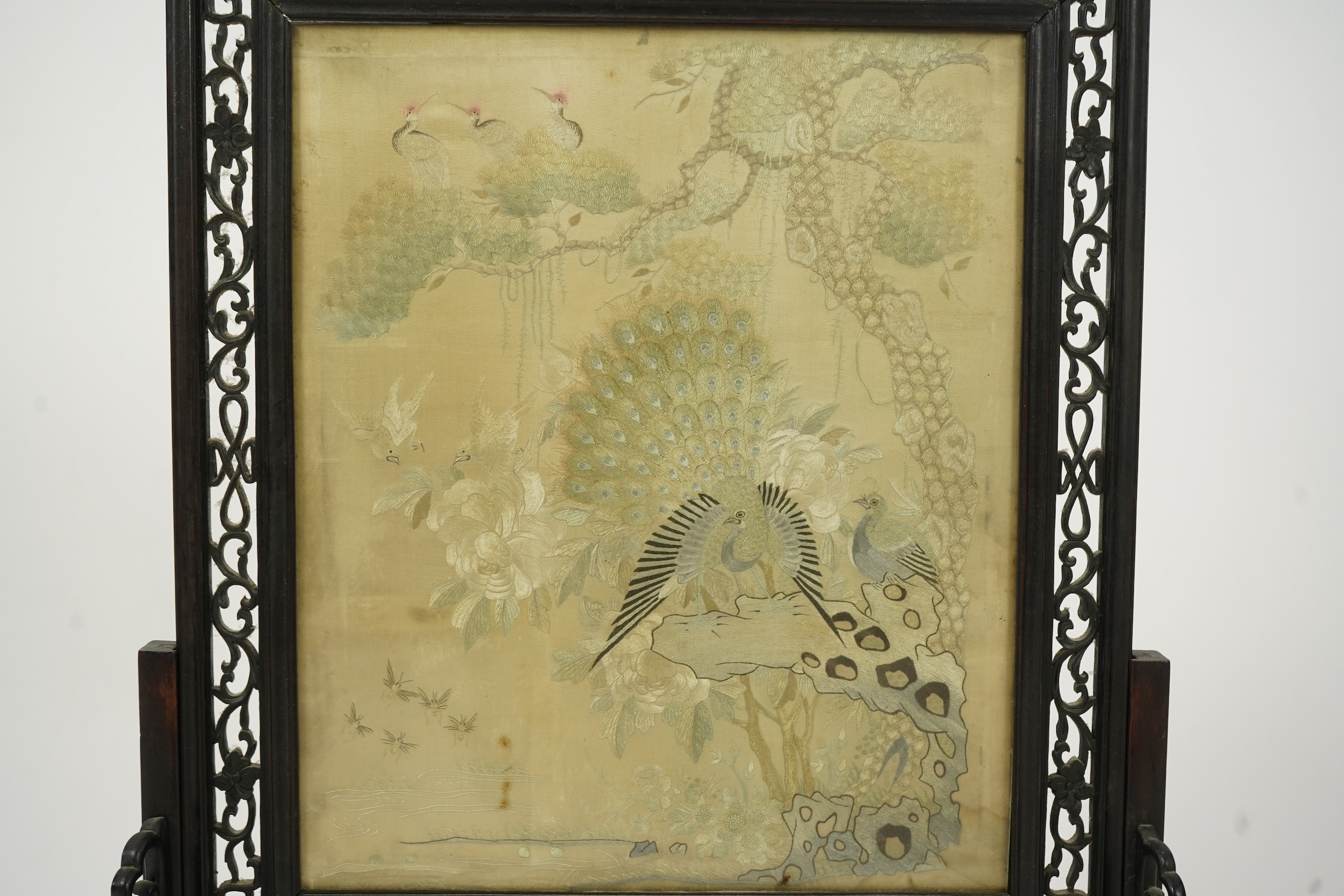 A Chinese ’Hundred bird’ embroidered silk table screen and hongmu stand, late 19th/early 20th century